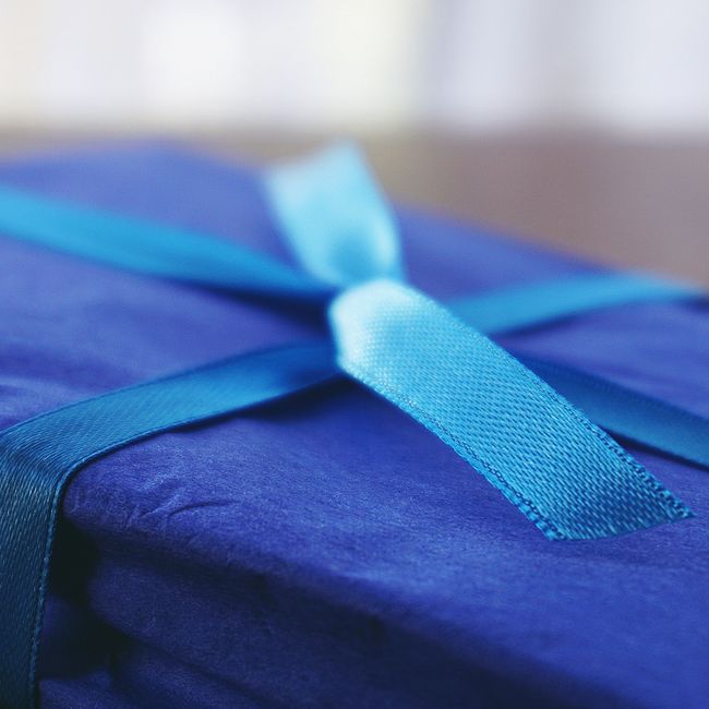 A gift box with a satin ribbon