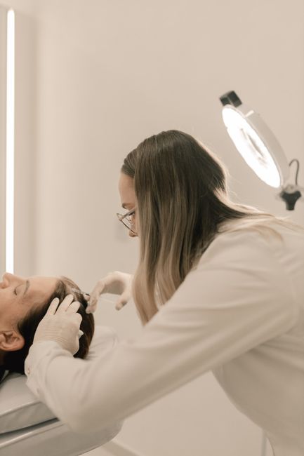 Dermatologist performing a treatment in a clinic setting
